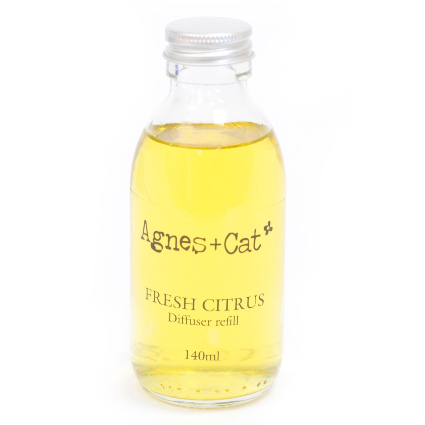 Glass bottle of Agnes + Cat Fresh Citrus diffuser refill on a white background