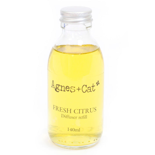 Glass bottle of Agnes + Cat Fresh Citrus diffuser refill on a white background
