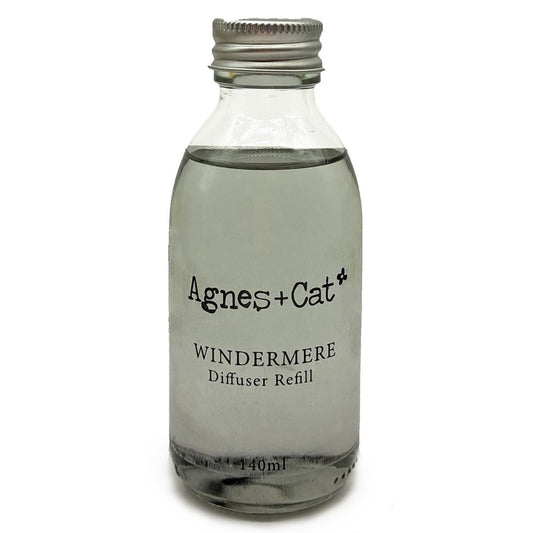 Glass diffuser refill bottle labeled 'Agnes + Cat Windermere' on a white background