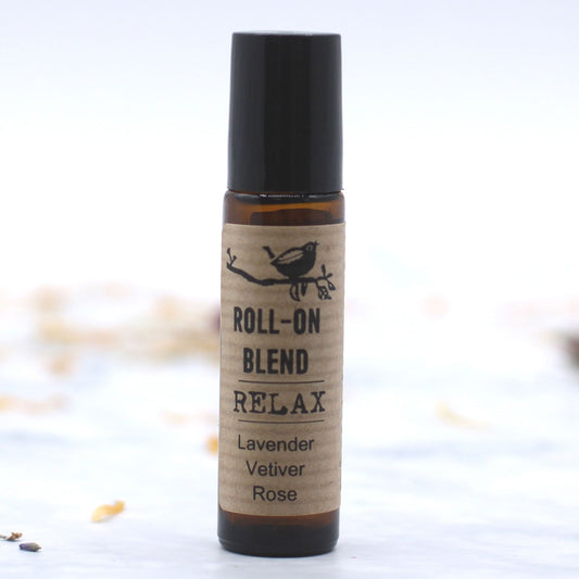 Roll-on blend bottle labeled 'Relax' with ingredients on a white background