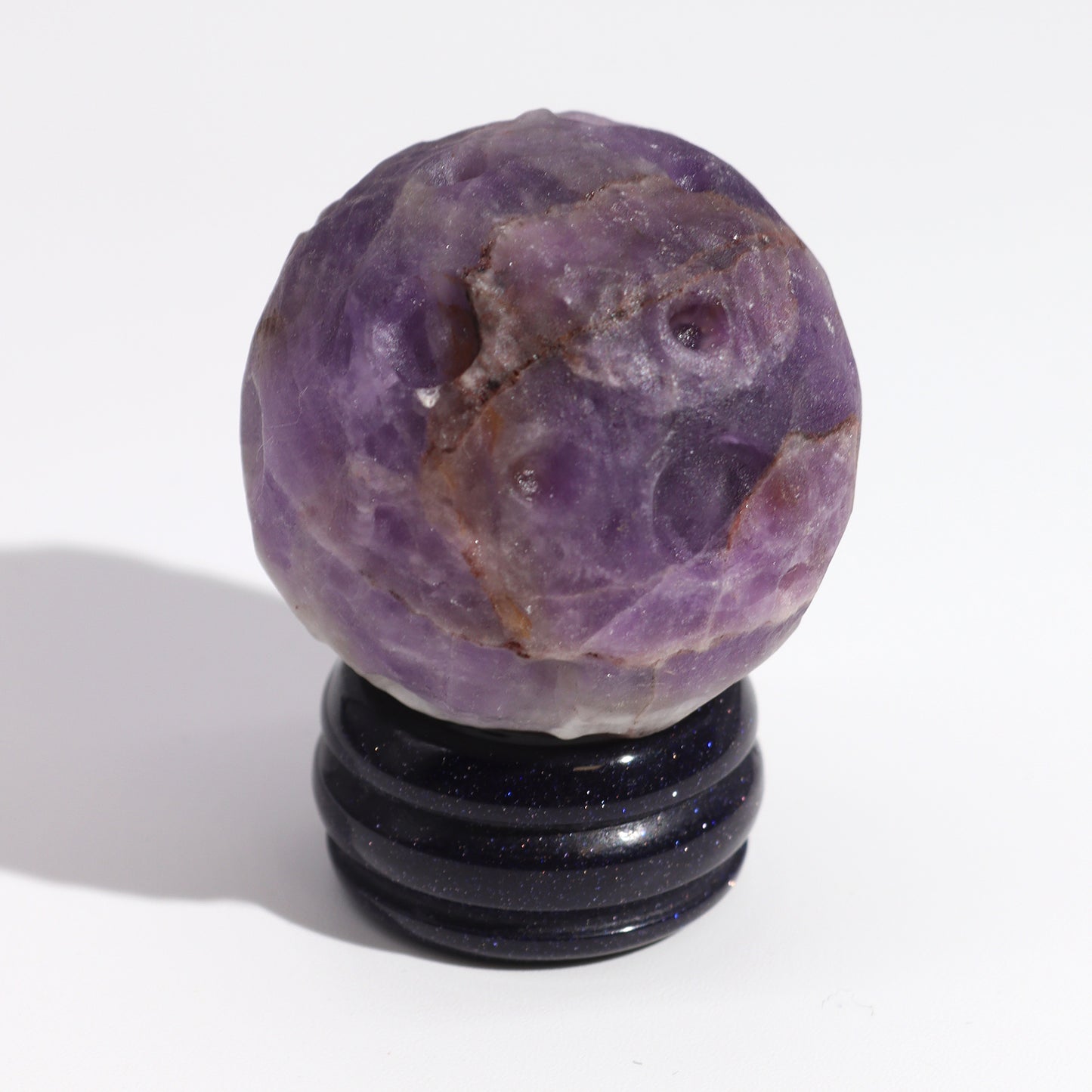 Invite the powerful energy of Jupiter into your space with this stunning Amethyst Planet. Expertly carved from genuine amethyst, a stone known for its connection to the crown chakra and spiritual growth