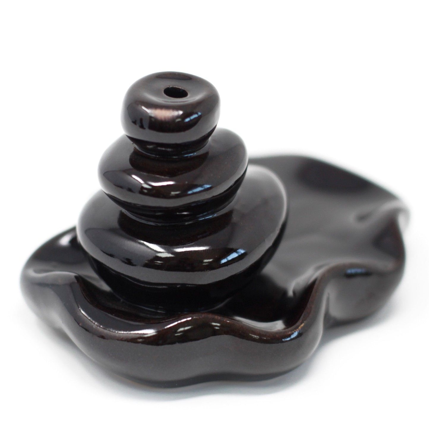 Black ceramic incense burner on a white background