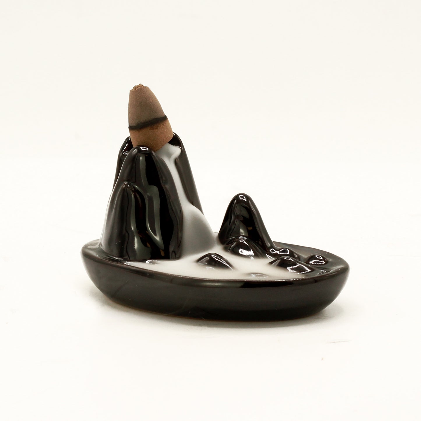Transform your home into a tranquil haven with a backflow incense burner Mini Mountain. Designed to work with backflow incense cones.