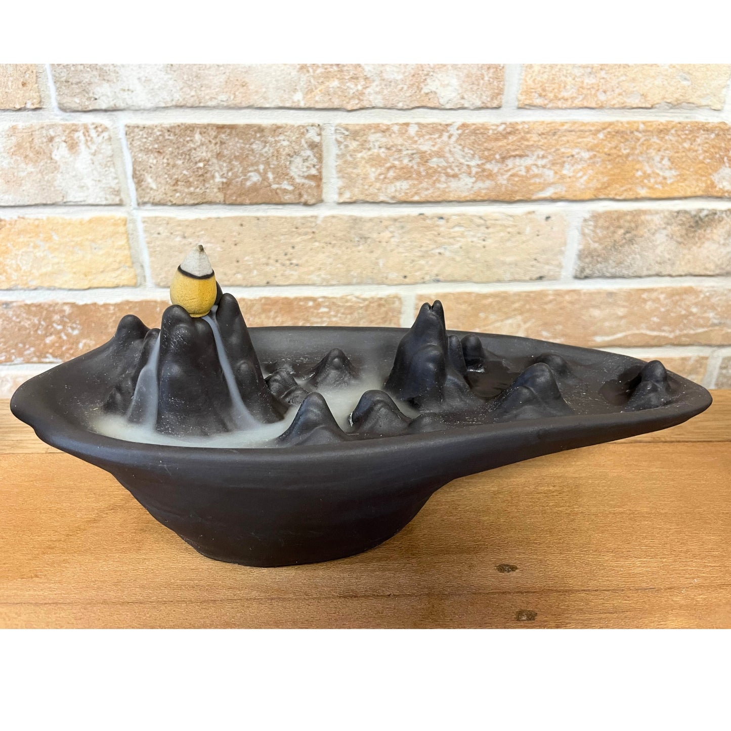 Transform your home into a tranquil haven with a backflow incense burner Mountain Scape. Designed to work with backflow incense cones