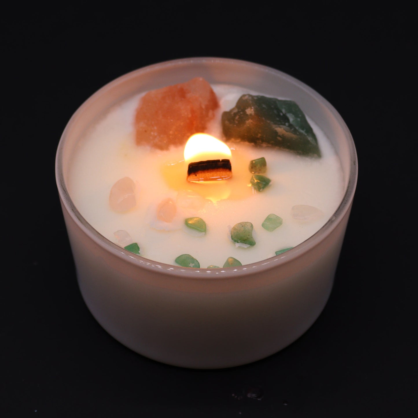 Unlock the power of your Heart Chakra with this enchanting soy wax crystal candle lit. Embedded with Rose Quartz and Crystal Jade crystals.