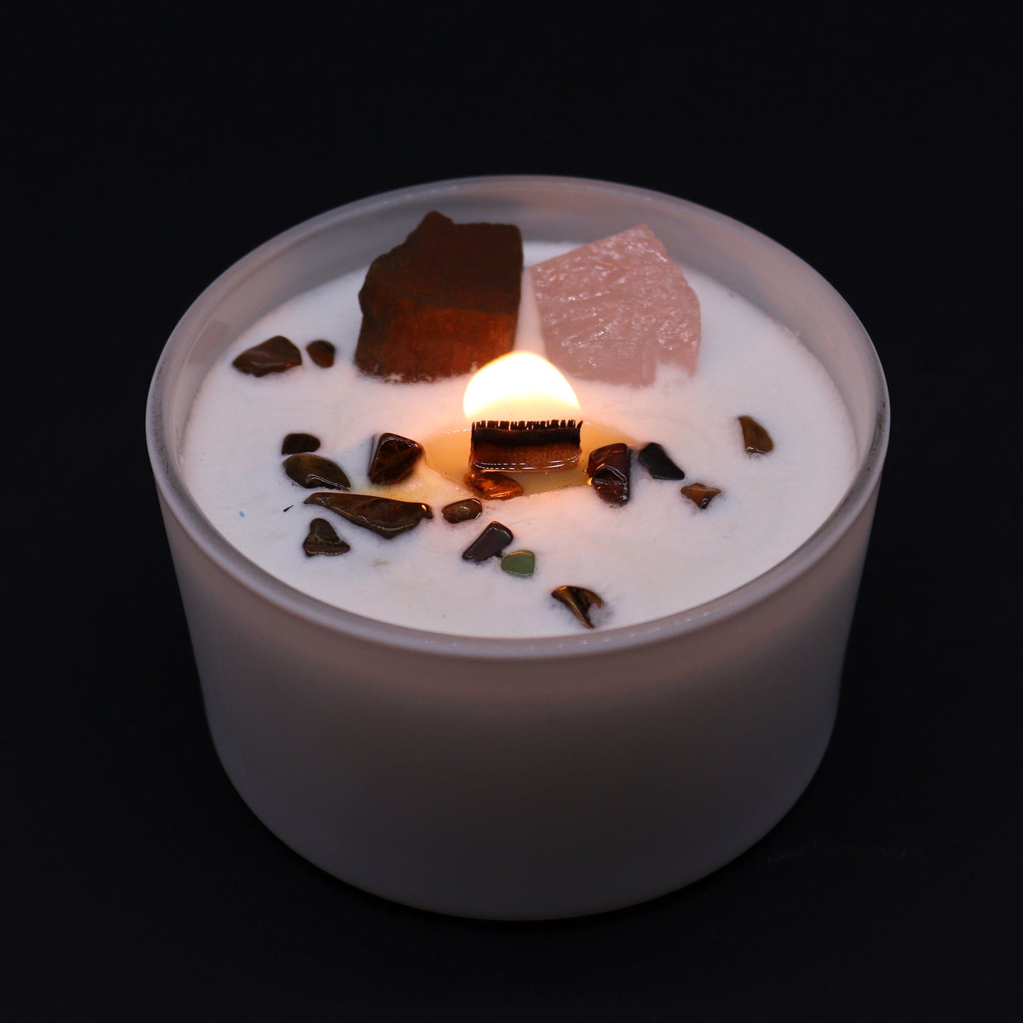 Unlock the power of your Sacred Sacral Chakra with this enchanting soy wax crystal candle. Embedded with Tiger Eye and Rose Quartz crystals, gemstones lit