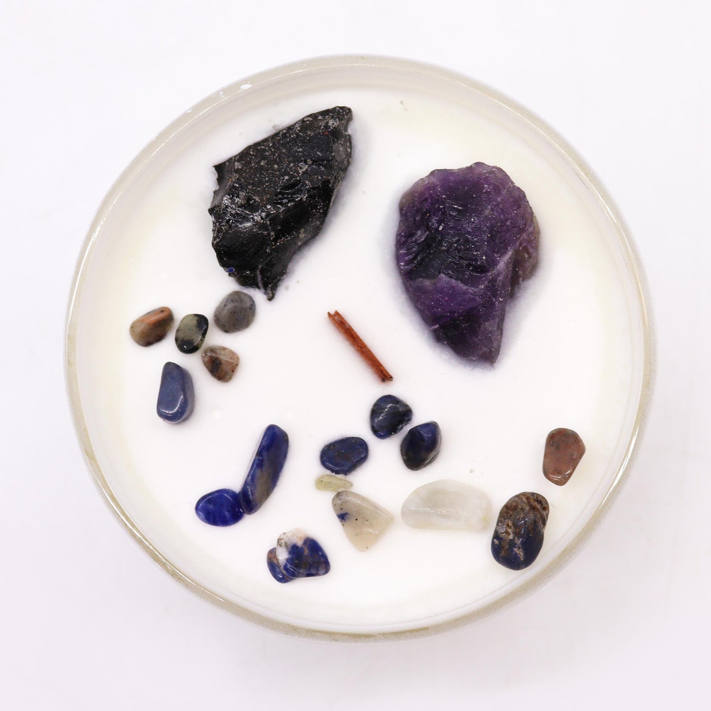 Unlock the power of your Solar Plexus Chakra with this enchanting soy wax crystal candle. Embedded with Amethyst and Black Agate crystal gemstones.