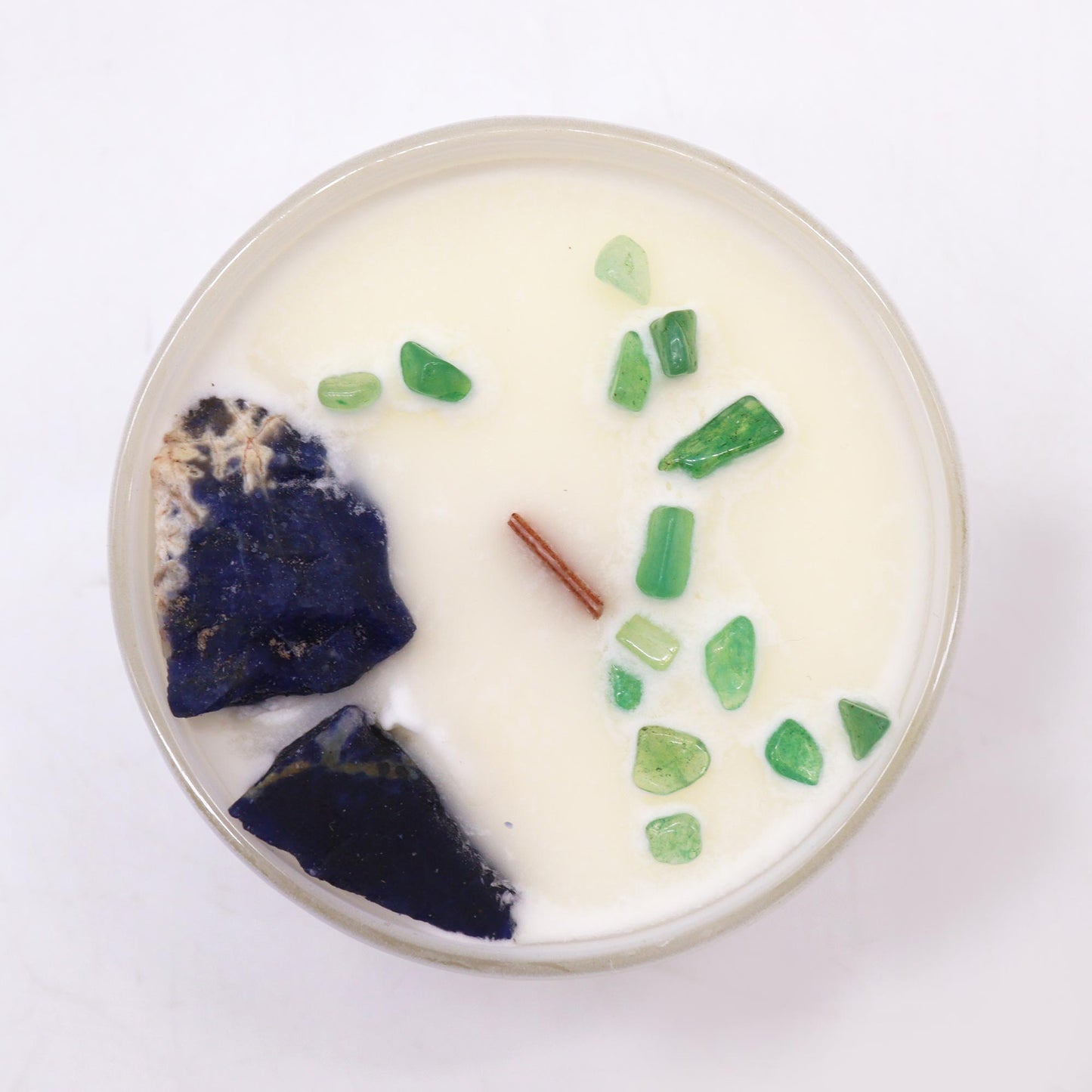 Unlock the power of your Throat Chakra with this enchanting soy wax crystal candle. Embedded with Sodalite and Jade Chips gemstones.