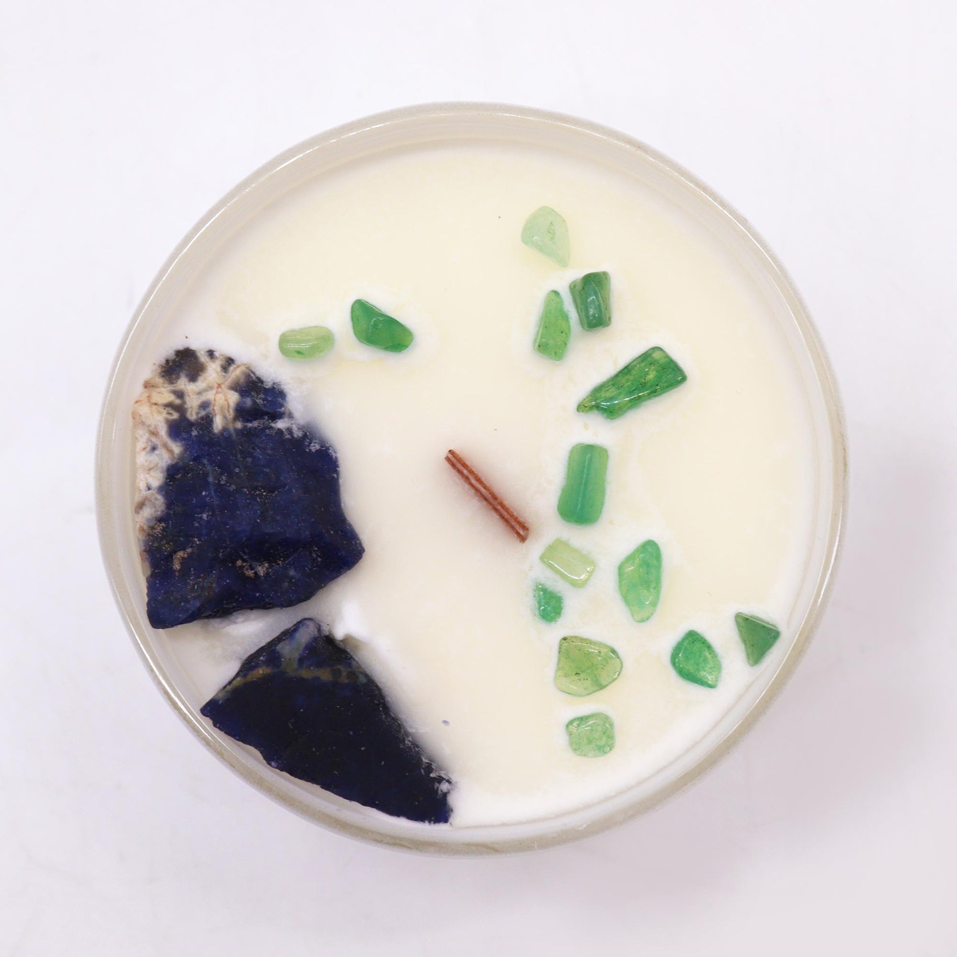 Unlock the power of your Throat Chakra with this enchanting soy wax crystal candle. Embedded with Sodalite and Jade Chips gemstones.