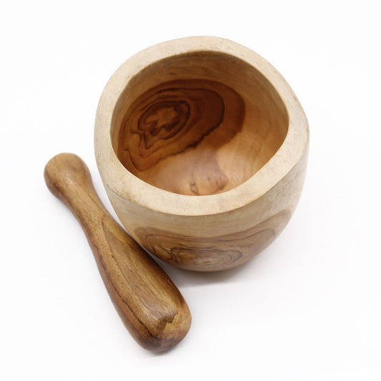 Wooden mortar and pestle on a white background