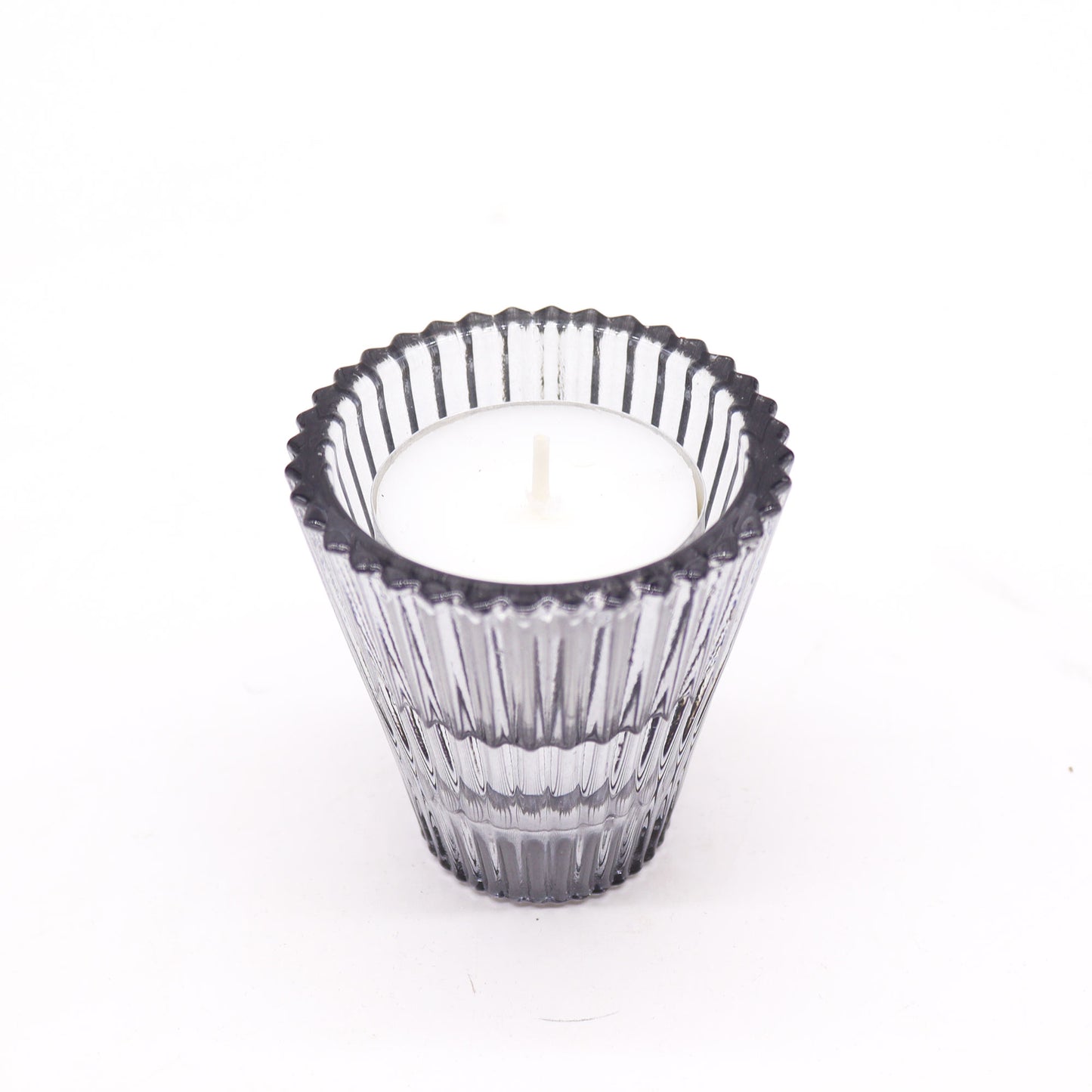 Add a touch of versatility and elegance to your home with the Flip Dinner Candle / Tealight Holder in Midnight Grey. Expertly crafted from high-quality glass