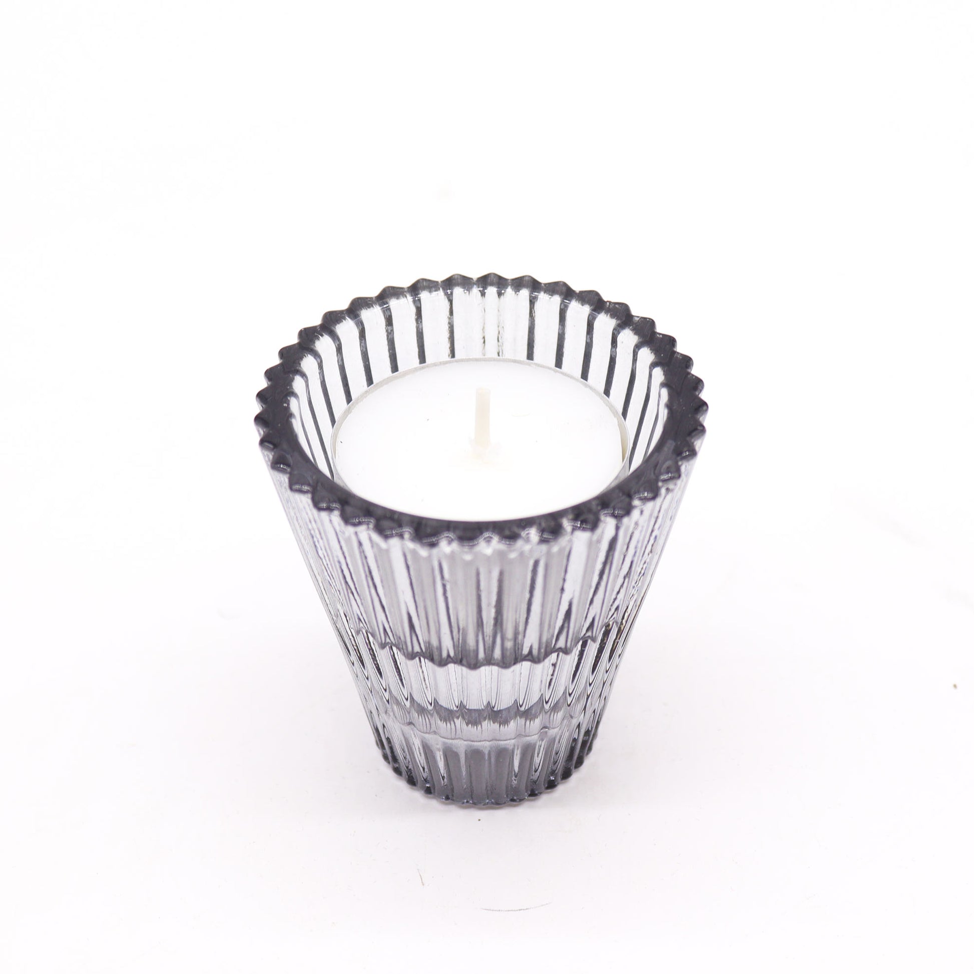 Add a touch of versatility and elegance to your home with the Flip Dinner Candle / Tealight Holder in Midnight Grey. Expertly crafted from high-quality glass