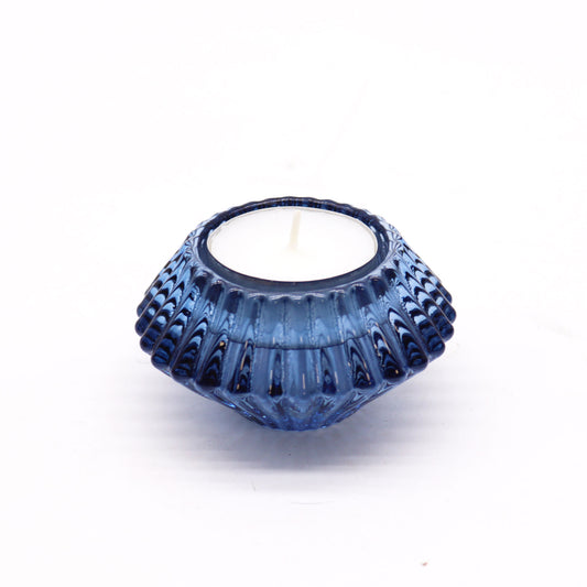 Add a touch of versatility and elegance to your home with the Flower Flip Dinner Candle / Tealight Holder in Royal Blue. Expertly crafted from high-quality glass