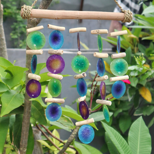 Bring a touch of natural elegance to your space with this handcrafted Green and Purple Driftwood Chime