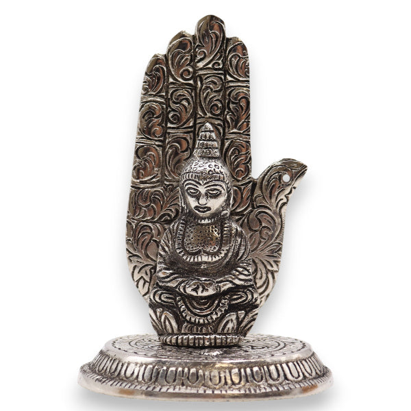 Decorative metal hand sculpture on a white background