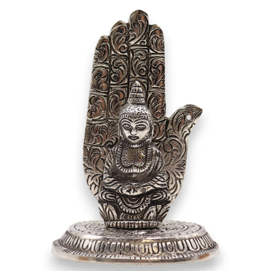 Decorative metal hand sculpture on a white background