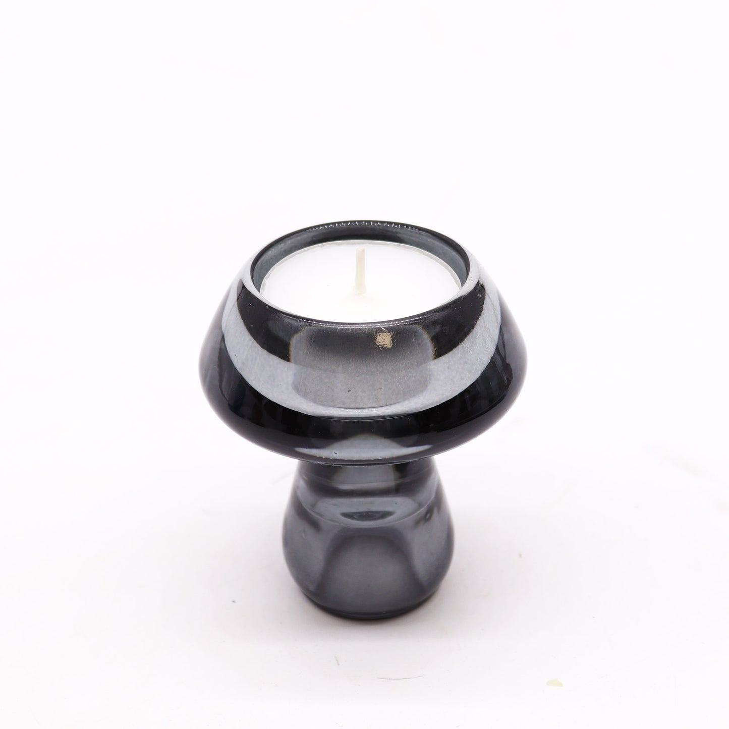 Mushroom Flip Dinner Candle / Tealight Holder in Midnight Grey is crafted from high-quality glass. This cleverly designed piece can be used with both dinner candles and tealights.