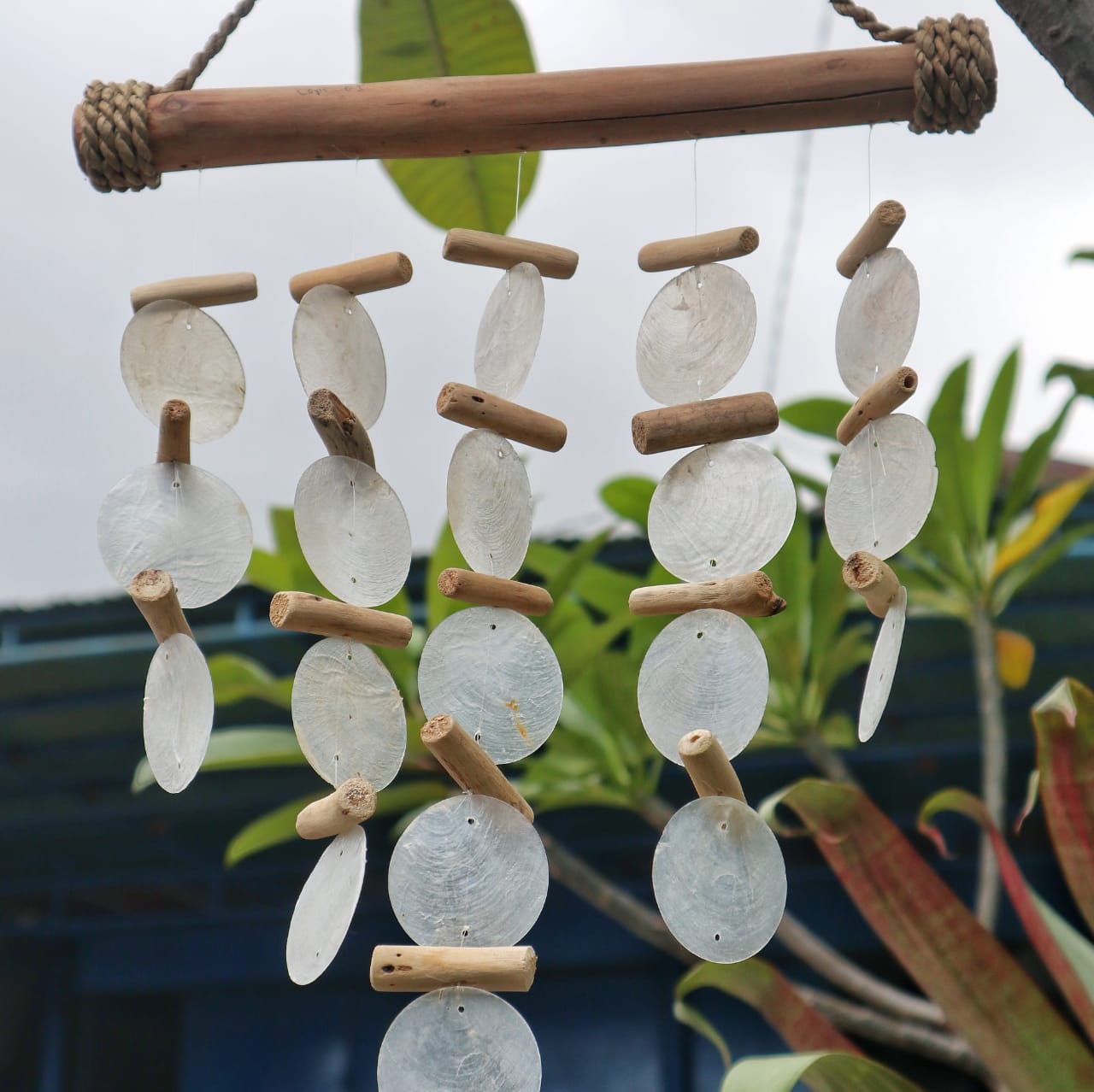 Bring a touch of natural elegance to your space with this handcrafted Pearl Effect Driftwood Chime
