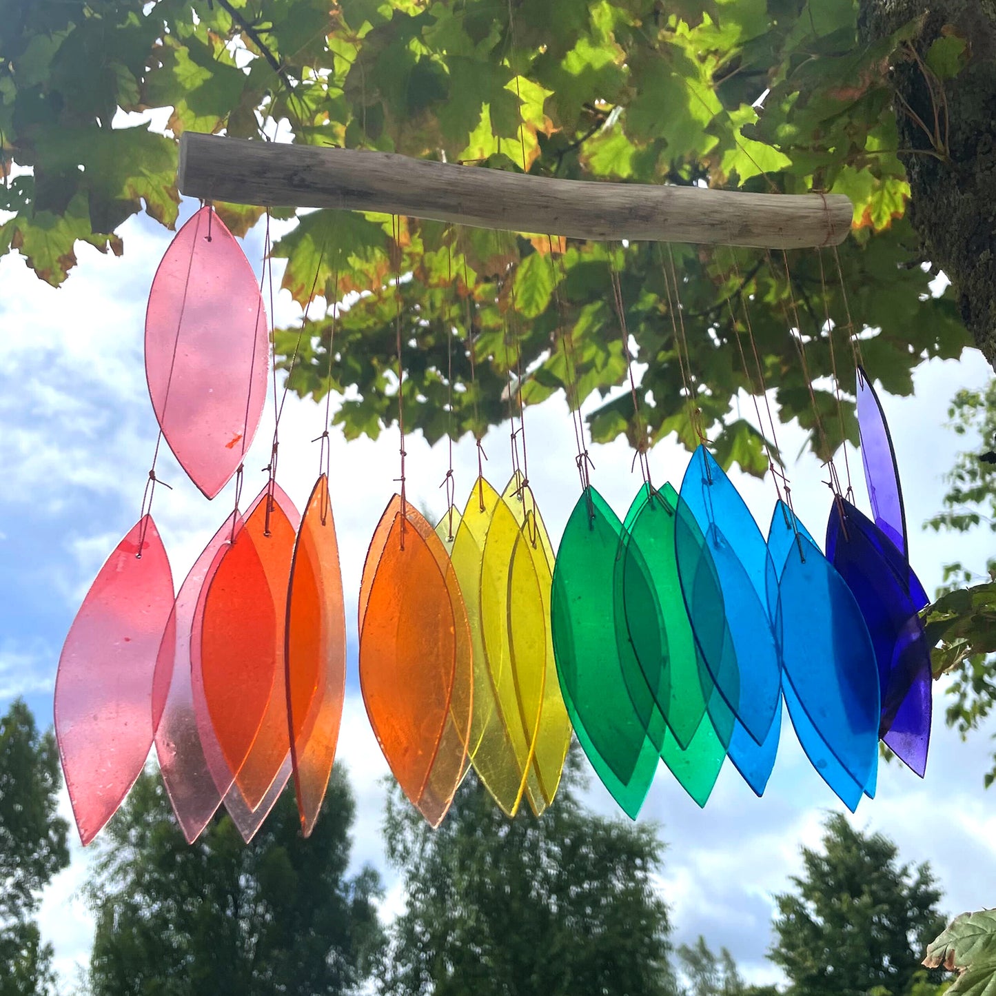 Bring harmony and a touch of nature to your outdoor space with a Recycled Glass Wind Chime Rainbow Glass
