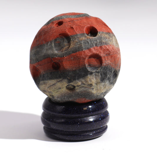 Channel the dynamic energy of Mars with this striking Red Jasper Planet. Crafted from genuine red jasper, a stone renowned for its grounding and energising properties, this planet symbolises strength, courage and vitality.