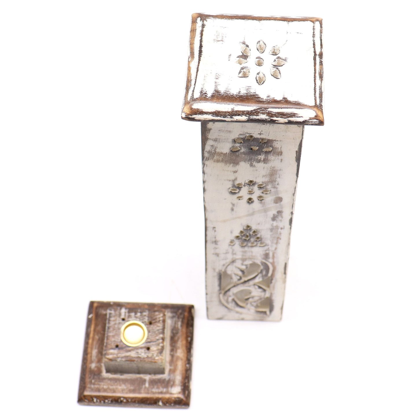 Decorative metal wall art with floral designs on a white background