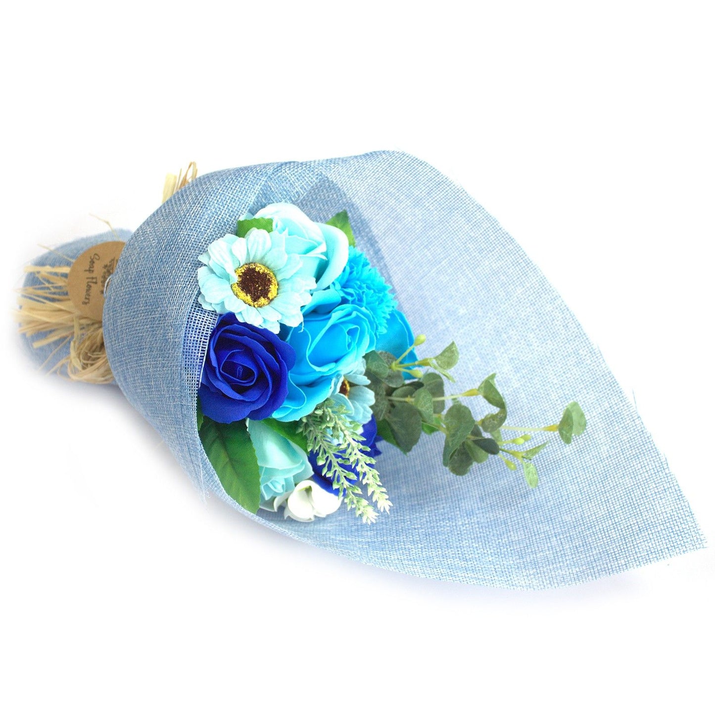 Bouquet of blue flowers wrapped in light blue paper on a white background