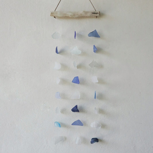 Bring harmony and a touch of nature to your outdoor space with a Recycled Glass Wind Chime Three Drop Blue & White.