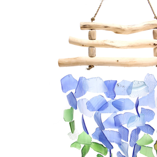 Bring harmony and a touch of nature to your outdoor space with a Recycled Glass Wind Chime Three Stick Blue & Green.
