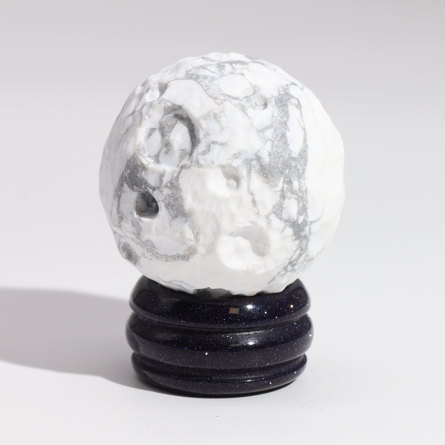 Embrace the calming and reflective energy of the Moon with this elegant White Howlite Planet.