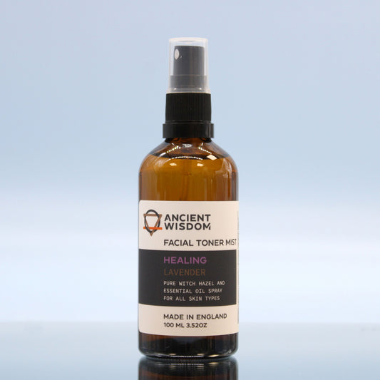 Bottle of Ancient Wisdom facial toner mist on a light blue background