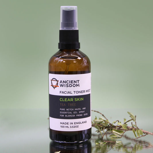 Facial toner mist bottle with 'Ancient Wisdom' label on a green background