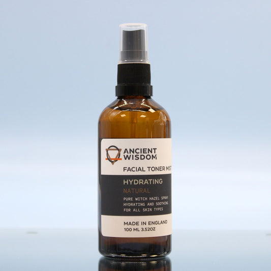 Facial toner mist bottle with 'Ancient Wisdom' label on a light blue background