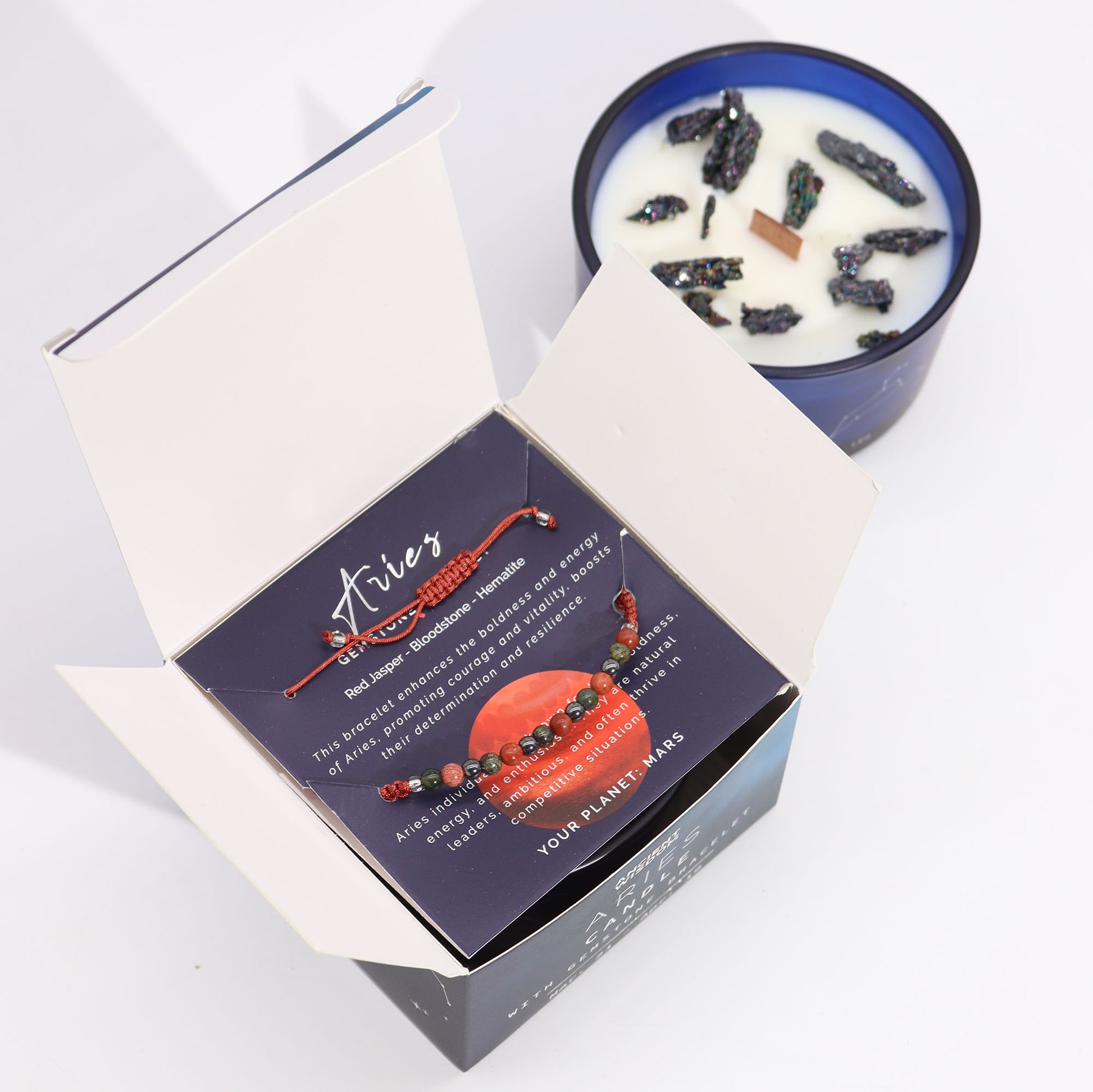 Zodiac Crystal Candle Aries with Gemstone Bracelet boxed is beautifully presented in a midnight blue glass jar adorned with silver-embossed star sign constellations.