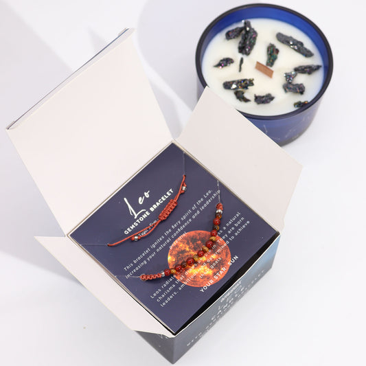 Zodiac Crystal Candle Leo with Gemstone Bracelet boxed is beautifully presented in a midnight blue glass jar adorned with silver-embossed star sign constellations.