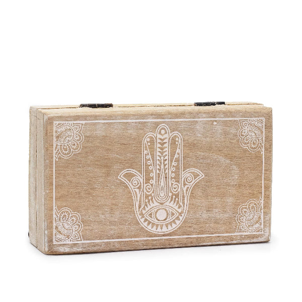 Wooden box with Hamsa hand design on a white background