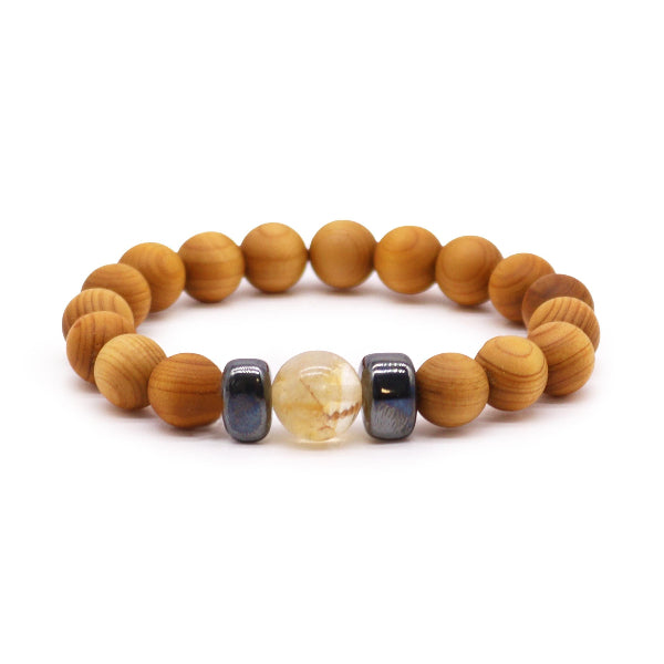 Wooden beaded bracelet with colorful focal beads on a white background