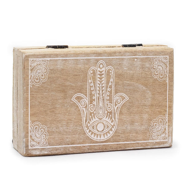 Wooden box with Hamsa hand design on a white background