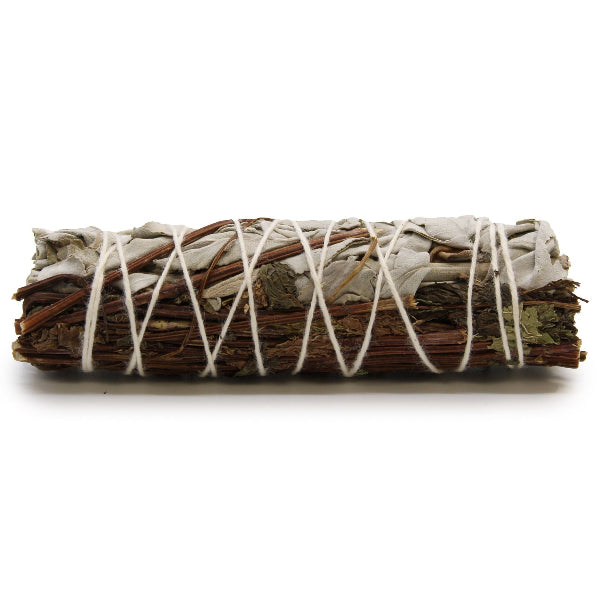 Bundled sage with twine on a white background