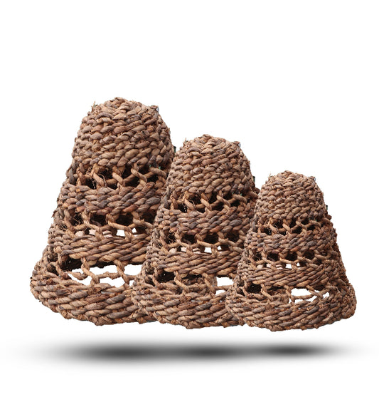 Three woven brown baskets of different sizes on a white background