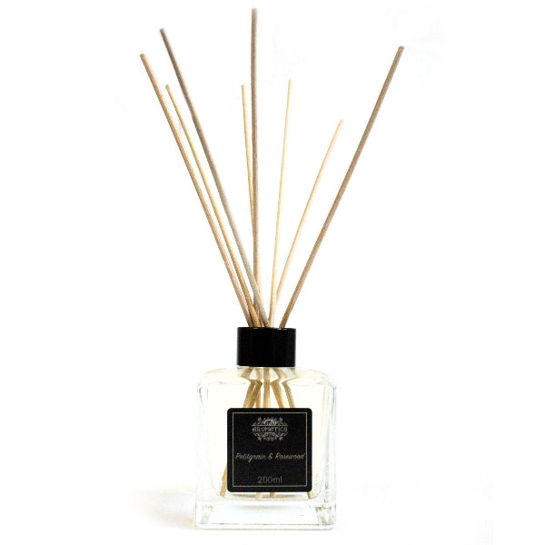 Diffuser with wooden sticks on a white background
