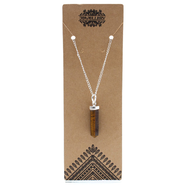 Necklace with a brown pendant on a brown jewelry card