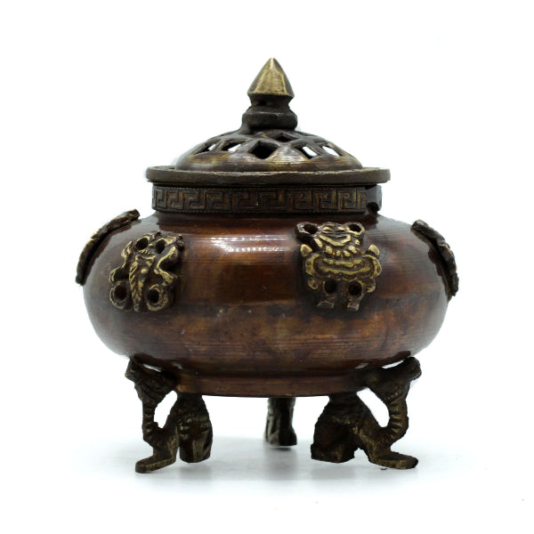 Bronze incense burner with lid on a white background