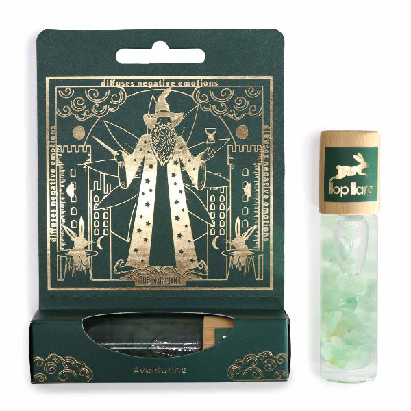 Packaged product with green and gold design, featuring a tube of green beads on a white background.
