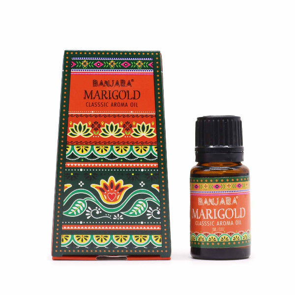 Bottle and box of Banjara Marigold aroma oil with colorful packaging on a white background