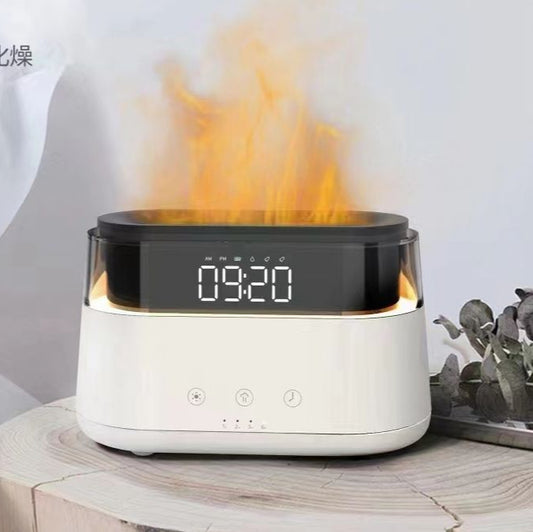 White electronic device with digital display and flame effect on a wooden surface.