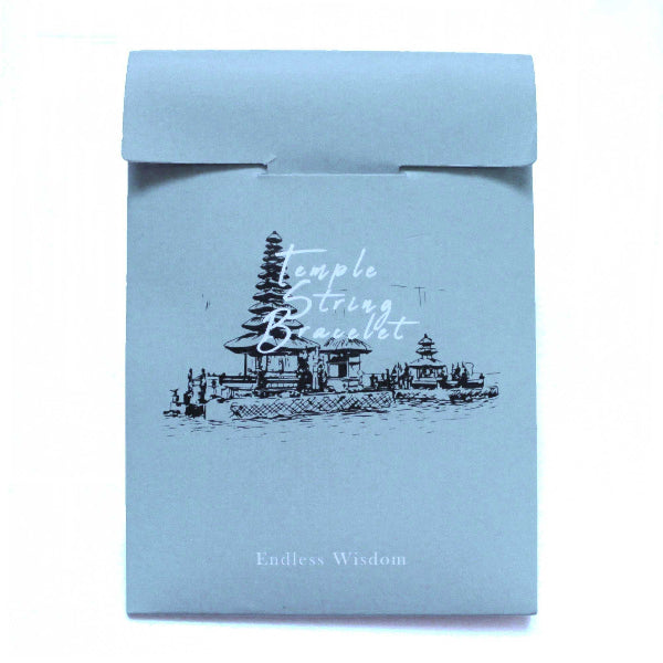 Blue packaging with temple design and text on a white background