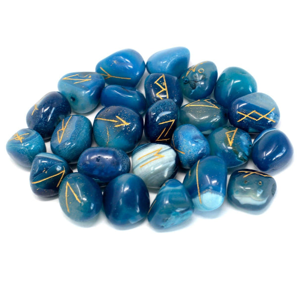 Blue stones with gold markings on a white background