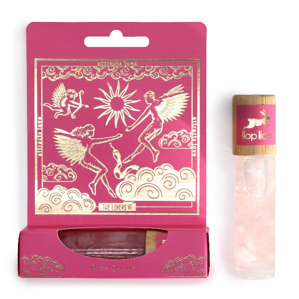 Pink packaging with angel designs and a small bottle labeled 'Lollipop' on a white background