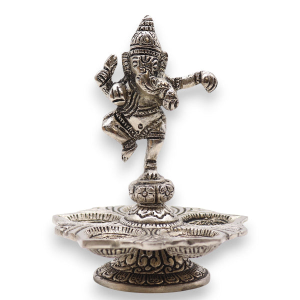 Decorative metal statue of a deity on a white background