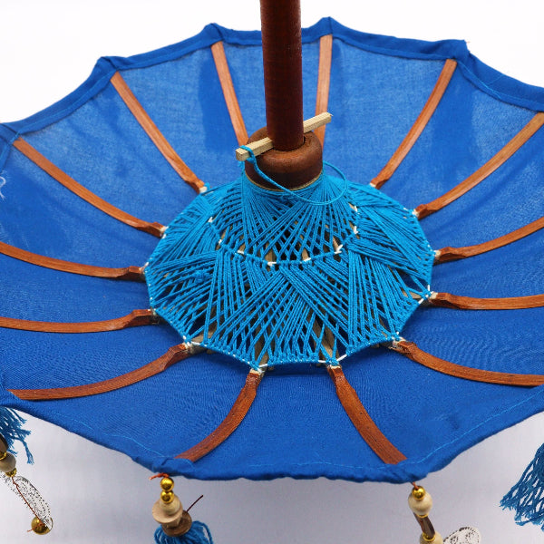 Blue decorative umbrella with brown accents on a white background